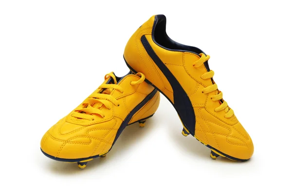 Botas de fútbol amarillas aisladas en el blanco — Foto de Stock