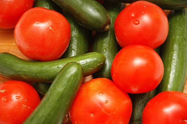 stock image Cucumbers and potatoes at the market display