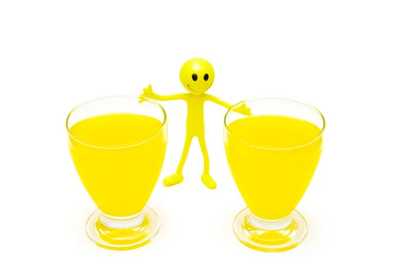 Two glasses of orange juice and smilie isolated on white — Stock Photo, Image