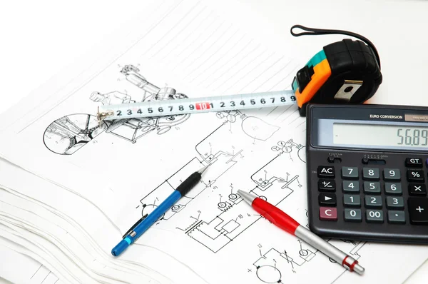 Design drawings, calculator, pens and measuring tape — Stock Photo, Image