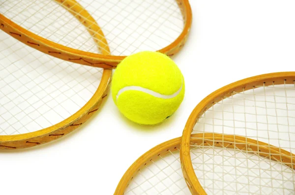 Four tennis rackets and balls isolated on white — Stock Photo, Image