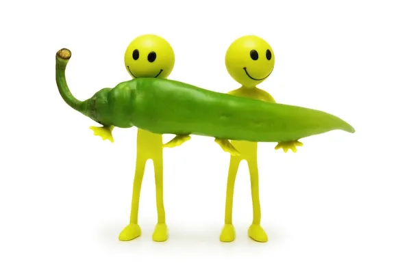 stock image Two smilies holding green pepper isolated on white