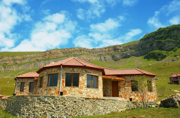 House in mountains — Stock Photo, Image
