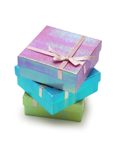 Gift boxes on top of each other isolated on white — Stock Photo, Image