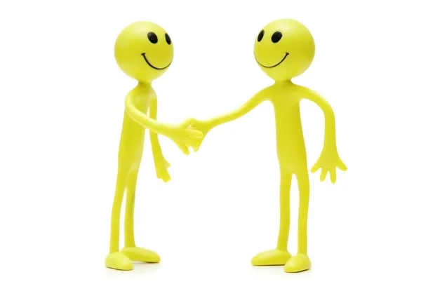 stock image Figures of smilies shaking hands