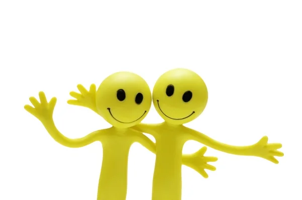 Figuren von Smileys, die sich umarmen — Stockfoto