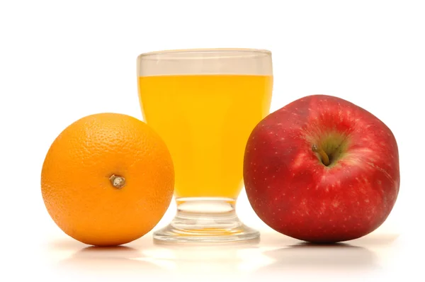 Orange, red apple and orange juice — Stock Photo, Image