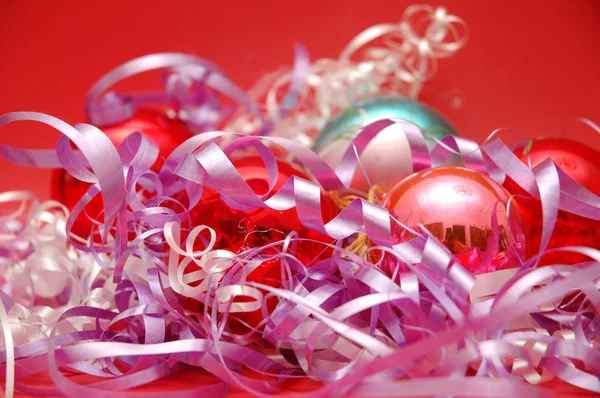 Various christmas decorations on red background — Stock Photo, Image