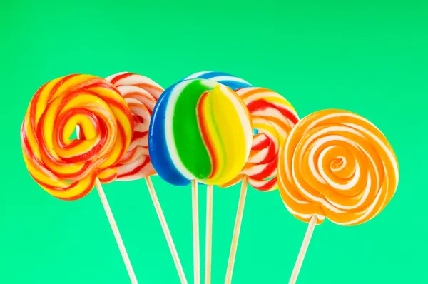 Colourful lollipop against the colourful background Royalty Free Stock Photos