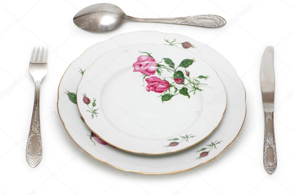 Plate and table utensils isolated on white — Stock Photo © Elnur_ 4425915