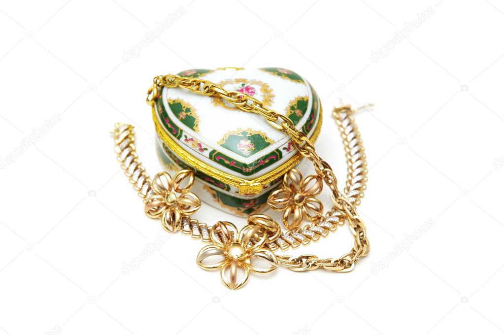 Various jewellery and heart-shaped box isolated on white