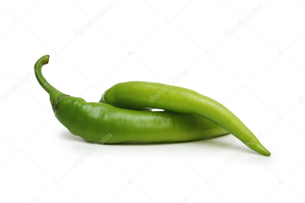 Two green chillies isolated on the white background