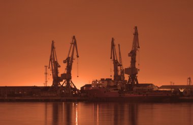 Baku port at night at sunrise clipart