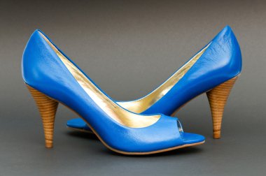 Fashion concept with blue woman shoes on high heels clipart