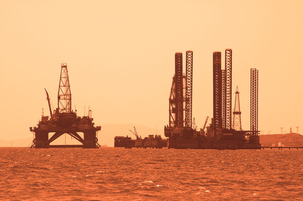 Oil rig during sunset in Baku, Azerbaijan in Caspian Sea
