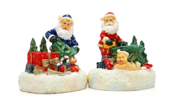 Figuras de Santa Claus aisladas en blanco —  Fotos de Stock