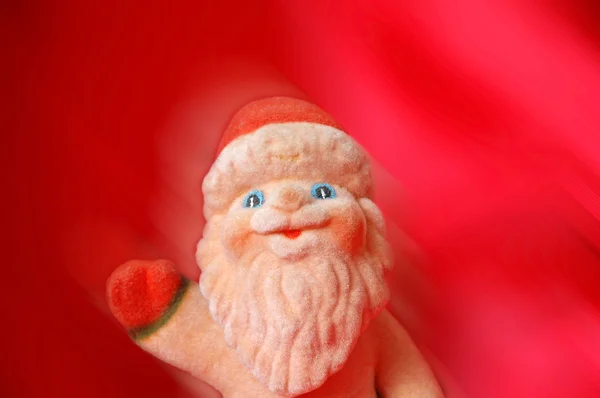 Санта-Клаус на красном фоне - движение размыто — стоковое фото