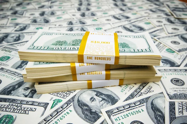Pila di dollari su sfondo di soldi — Foto Stock