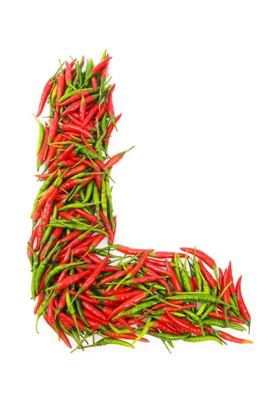 Алфавит с зеленым и красным перцем — стоковое фото