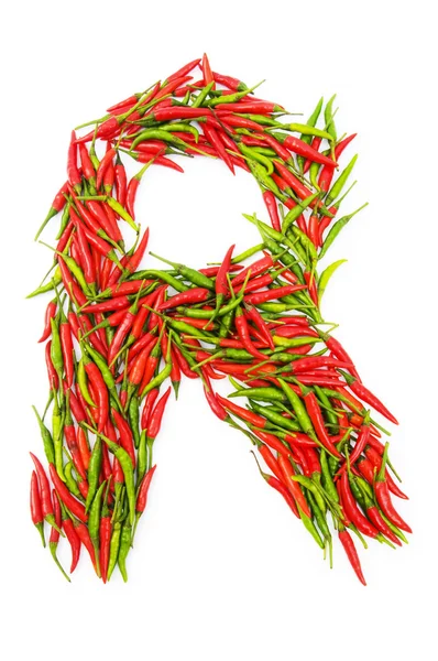 Алфавит с зеленым и красным перцем - буква — стоковое фото