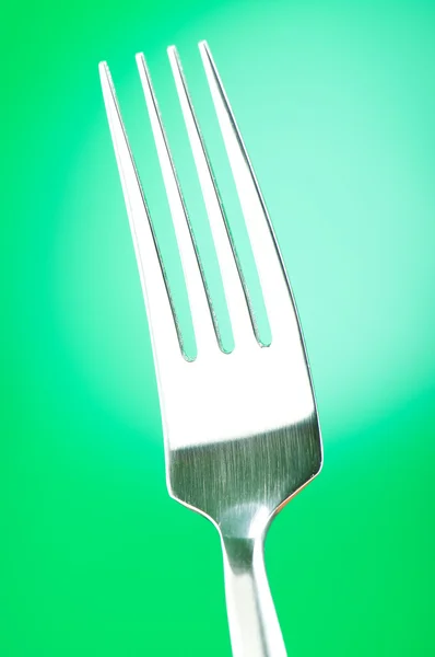 Zilveren vork tegen de achtergrond van de kleur voor de kleurovergang — Stockfoto