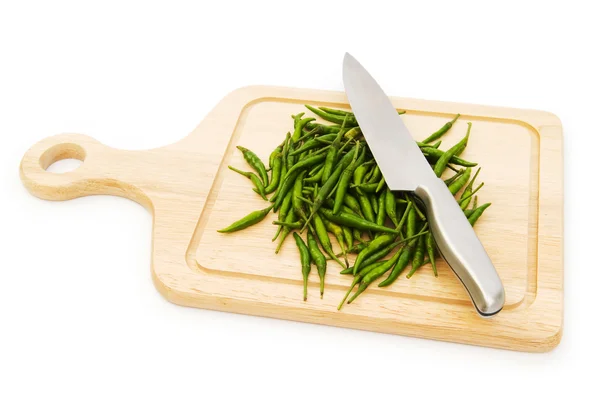 Pepper and cutting board isolated on the white — Stock Photo, Image