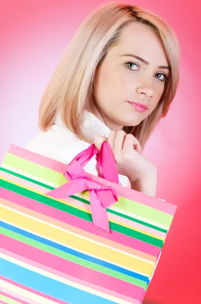 Blond girl with shopping bag — Stock Photo, Image