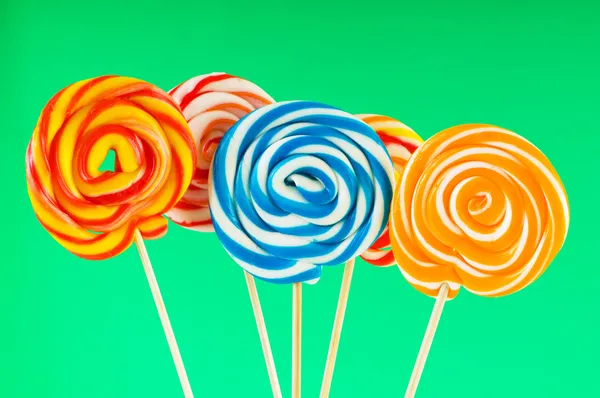 Colourful lollipop against the colourful background Royalty Free Stock Images