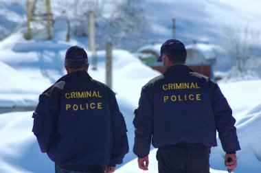 Criminal Police patrolling in winter clipart