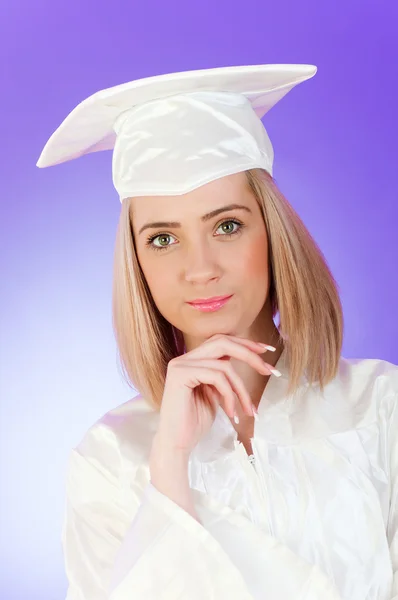 Renkli bir arka plana dayanır mutlu mezunu — Stok fotoğraf
