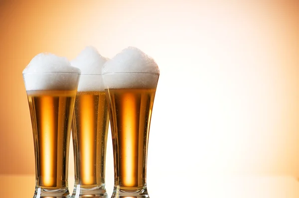 stock image Beer glasses against the colorful gradient background