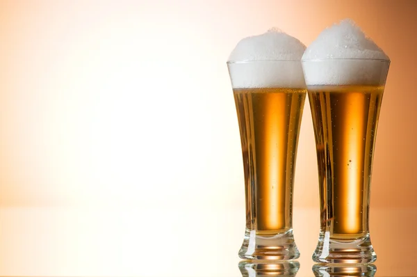 stock image Beer glasses against the colorful gradient background