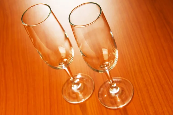 Wine glasses against wooden background — Stock Photo, Image