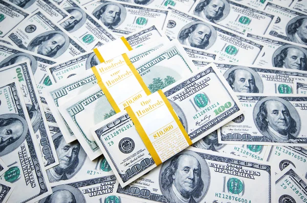 Stack of dollars on money background Royalty Free Stock Images
