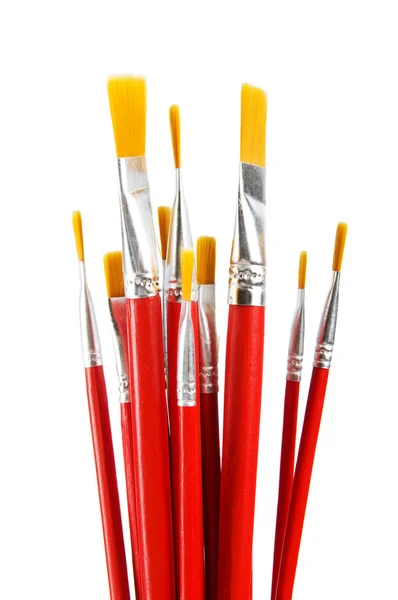Escovas de arte vermelha isoladas no fundo branco — Fotografia de Stock