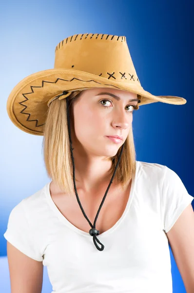 Young girl wearing cowboy hat in the studio — Stock Photo, Image
