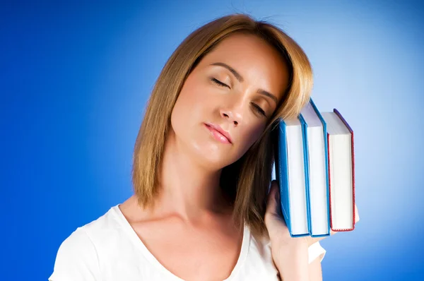 Young university student with many study textbooks — Stock Photo, Image
