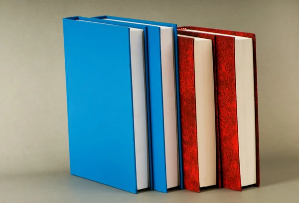 Stack of books on the color background — Stock Photo, Image