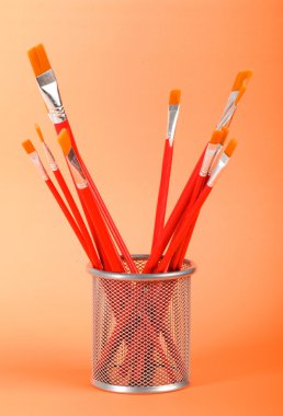 Red art brushes on the color background clipart