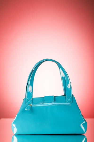 stock image Blue bag against the colorful gradient background