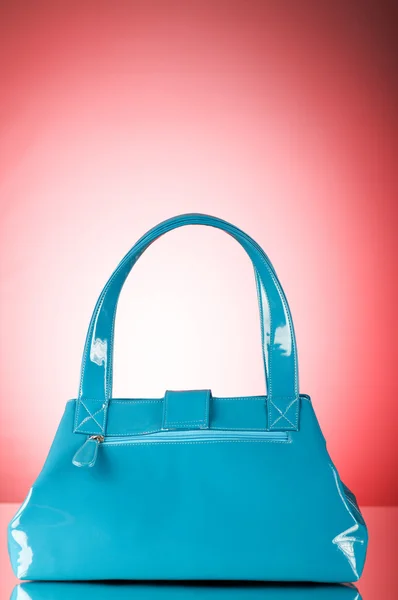 stock image Blue bag against the colorful gradient background