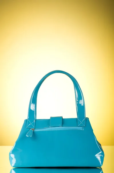 stock image Blue bag against the colorful gradient background