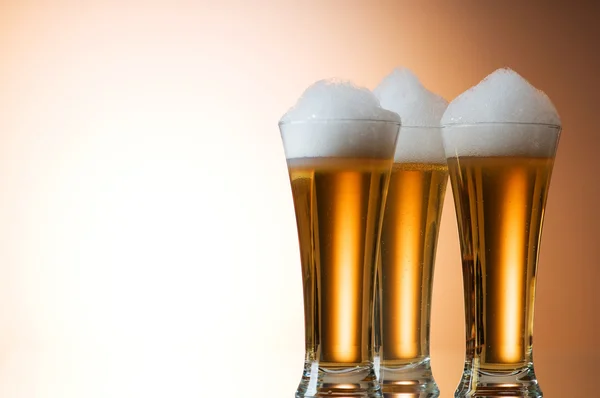 stock image Beer glasses against the colorful gradient background