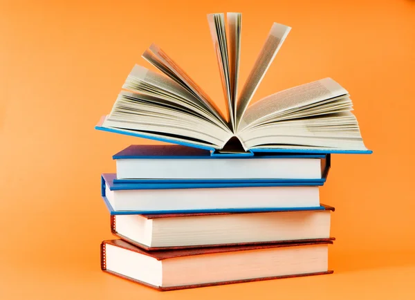 Stack of books on the color background — Stock Photo, Image