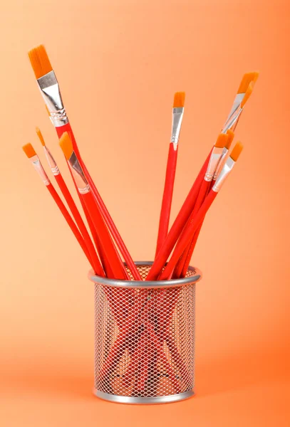 Red art brushes on the color background — Stock Photo, Image