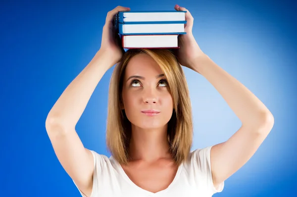 Young university student with many study textbooks — Stock Photo, Image