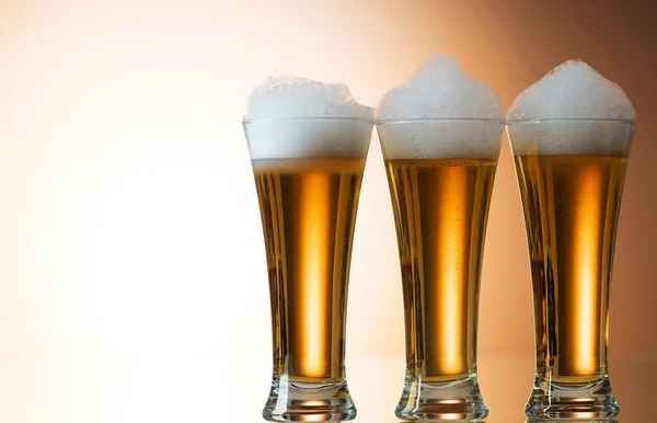 stock image Beer glasses against the colorful gradient background