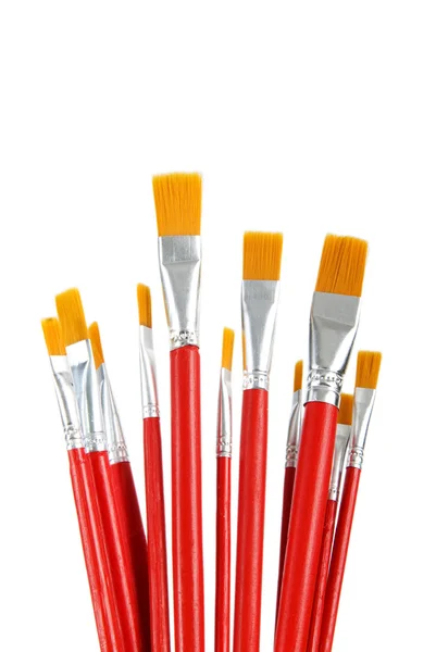 Escovas de arte vermelha isoladas no fundo branco — Fotografia de Stock