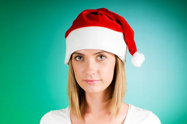 女孩与圣诞老人帽子渐变背景 — 图库照片