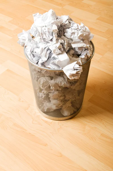 Garbage bin with paper waste isolated on white — Stock Photo, Image